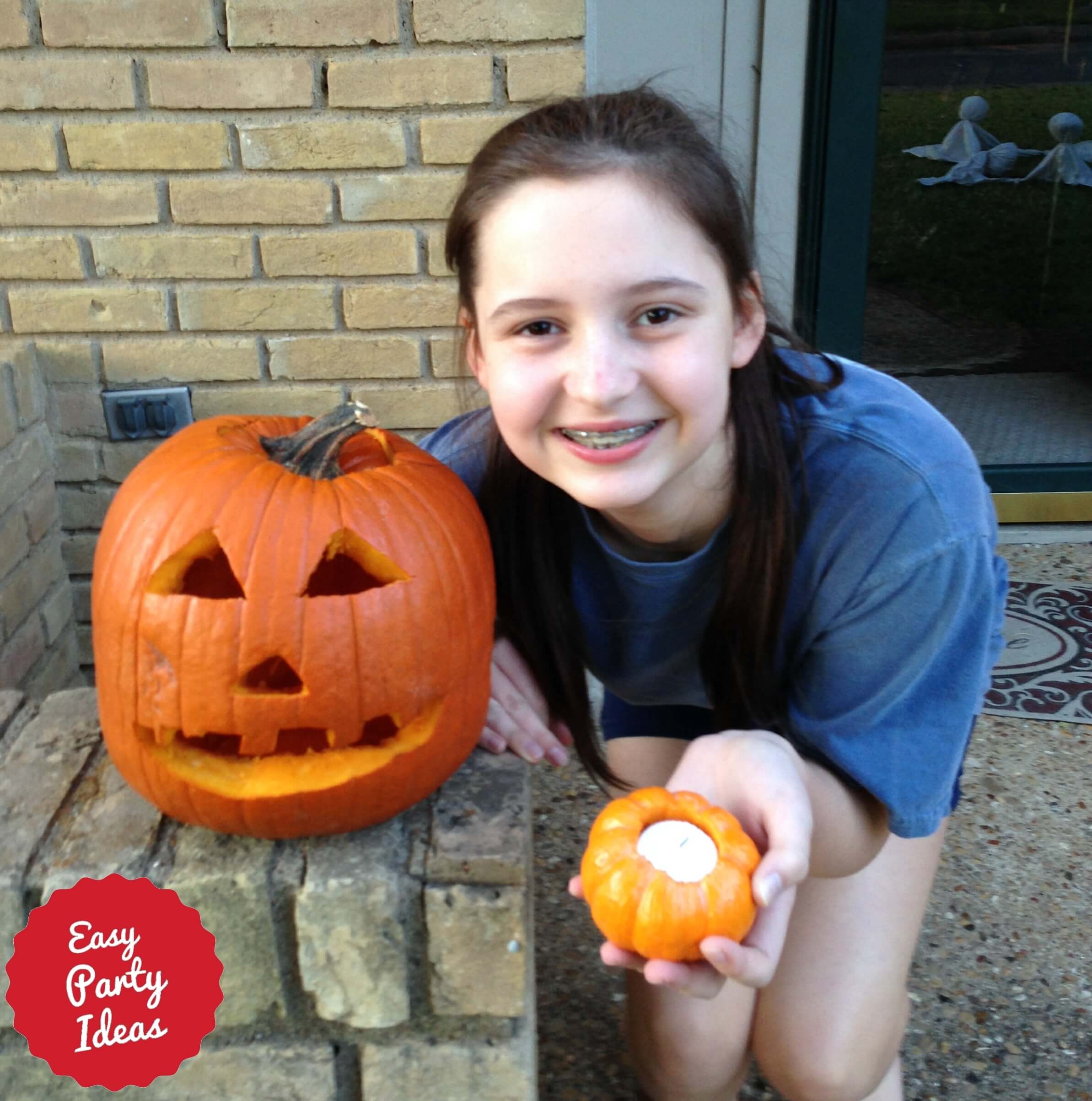 Girl with carved pumpkins